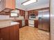 Cozy kitchen with stainless steel appliances, wooden cabinets, and a functional layout at 10831 Canoe Ct, Indianapolis, IN 46236