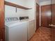 Laundry room with washer, dryer, and shelving at 10831 Canoe Ct, Indianapolis, IN 46236