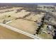 Expansive aerial view of a property with fields, trees, and several houses at 1125 S Buffalo Hill Rd, Martinsville, IN 46151