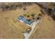 An aerial image of a home with an outbuilding and long drive surrounded by ample land, showcasing rural living at 1125 S Buffalo Hill Rd, Martinsville, IN 46151