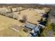 Expansive aerial view of property featuring home, farmland, mature trees and long private driveway at 1125 S Buffalo Hill Rd, Martinsville, IN 46151