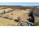 Scenic aerial view of a home with a long driveway and a tree-lined landscape at 1125 S Buffalo Hill Rd, Martinsville, IN 46151