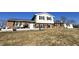 Charming split-level home with brick accents, a white picket fence, and a well-maintained lawn at 1125 S Buffalo Hill Rd, Martinsville, IN 46151