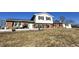 Exterior elevation of two-story brick home featuring a patio, grill and mature landscaping at 1125 S Buffalo Hill Rd, Martinsville, IN 46151