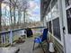Cozy back deck with outdoor seating, a barbecue grill, and peaceful woodland views at 11521 Coastal Dr, Indianapolis, IN 46229