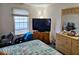 Cozy bedroom featuring a large window and comfortable furnishings at 11521 Coastal Dr, Indianapolis, IN 46229
