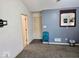Bedroom with blue accent wall, plush carpet and natural light at 11521 Coastal Dr, Indianapolis, IN 46229