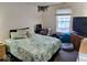 Cozy bedroom with a comfortable bed, study desk, and a window allowing ample natural light at 11521 Coastal Dr, Indianapolis, IN 46229