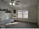 Bonus room featuring neutral carpet, ample natural light, and room for multiple tables at 11521 Coastal Dr, Indianapolis, IN 46229