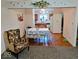 Inviting dining area with hardwood floors, bench seating, and easy access to the kitchen at 11521 Coastal Dr, Indianapolis, IN 46229