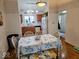 Cozy dining area featuring a beach themed tablecloth, and hardwood floors, adjacent to the kitchen at 11521 Coastal Dr, Indianapolis, IN 46229