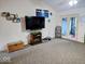 Inviting living room with fireplace and patio doors offering lots of natural light at 11521 Coastal Dr, Indianapolis, IN 46229