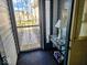 Enclosed front porch with decorative metal security door and charming beach-themed decor at 11521 Coastal Dr, Indianapolis, IN 46229