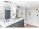 Bright bathroom features a shower, double vanity with quartz counters, and modern fixtures at 1234 S Talbott St, Indianapolis, IN 46225