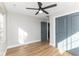 Bedroom featuring wood-look flooring, a ceiling fan and a closet with bi-fold doors at 1234 S Talbott St, Indianapolis, IN 46225