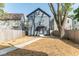 Charming home with a manicured front lawn, walkway, and mature trees at 1234 S Talbott St, Indianapolis, IN 46225