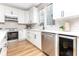 Bright kitchen features white cabinets, modern appliances, and a stylish subway tile backsplash at 1234 S Talbott St, Indianapolis, IN 46225