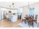 Bright kitchen featuring an island with seating, stainless steel appliances, and modern light fixtures at 1234 S Talbott St, Indianapolis, IN 46225