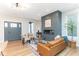 Bright living room with a contemporary fireplace, hardwood floors, and an open layout at 1234 S Talbott St, Indianapolis, IN 46225