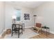 Cozy home office with ample natural light, modern decor, and comfortable seating at 1234 S Talbott St, Indianapolis, IN 46225