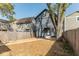 Charming two-story home with a fully fenced yard and walkway at 1234 S Talbott St, Indianapolis, IN 46225