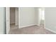 Spacious bedroom with neutral carpet, and multiple door frames, offering versatile design options and ample space at 1274 Newton St, Avon, IN 46123