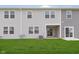 Rear exterior of a multi-story building with a well-maintained lawn and ample natural light at 1274 Newton St, Avon, IN 46123