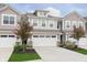 Charming townhome featuring a two-car garage, traditional design, and manicured landscaping at 1274 Newton St, Avon, IN 46123