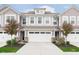 Charming townhome featuring a two-car garage, traditional design, and manicured landscaping at 1274 Newton St, Avon, IN 46123