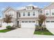 Charming townhome featuring a two-car garage, traditional design, and manicured landscaping at 1274 Newton St, Avon, IN 46123
