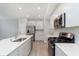 Well-equipped kitchen featuring modern appliances, sleek cabinetry, and a spacious countertop island at 1274 Newton St, Avon, IN 46123