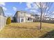 Spacious backyard with patio, swing set, and mature tree perfect for outdoor activities at 1299 Timber Bluff Rd, Westfield, IN 46074