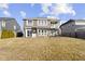 Large backyard with swing set, covered patio, and lush lawn provides ample outdoor space at 1299 Timber Bluff Rd, Westfield, IN 46074