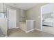 Bathroom with tiled flooring, a built-in tub with tiled surround, and a door to the bedroom at 1299 Timber Bluff Rd, Westfield, IN 46074