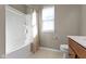 Bathroom featuring a shower and bathtub combination with a window at 1299 Timber Bluff Rd, Westfield, IN 46074