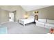 Large primary bedroom features an open floor plan and a seating area at 1299 Timber Bluff Rd, Westfield, IN 46074
