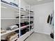 Walk-in closet with ample built-in white shelving for efficient storage and organization at 1299 Timber Bluff Rd, Westfield, IN 46074