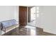 Entryway featuring hardwood floors, a bench, and a view of the front door at 1299 Timber Bluff Rd, Westfield, IN 46074