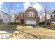 Traditional two-story brick home featuring an attached two-car garage and a well-manicured front lawn at 1299 Timber Bluff Rd, Westfield, IN 46074