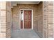 Close-up of front door featuring a brick surround and a classic design at 1299 Timber Bluff Rd, Westfield, IN 46074