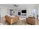 Bright and airy living room featuring a fireplace, built-in shelves, hardwood floors, and a comfortable seating area at 1299 Timber Bluff Rd, Westfield, IN 46074