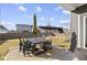 Backyard patio with outdoor dining set, a green umbrella and play set at 1299 Timber Bluff Rd, Westfield, IN 46074