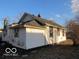Backside view of a house showcasing white siding and dark window trim at 1310 E 5Th St, Muncie, IN 47302