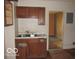 Kitchen featuring worn cabinets and a basic sink at 1310 E 5Th St, Muncie, IN 47302