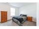 Bedroom featuring carpet flooring, a window, and two nightstands at 1381 Delacorte Cir, Shelbyville, IN 46176