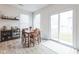Cozy dining area with a wooden table, a sliding glass door, and stylish décor at 1381 Delacorte Cir, Shelbyville, IN 46176