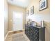 Inviting entryway featuring a decorative console table and a bright front door with glass panels at 1381 Delacorte Cir, Shelbyville, IN 46176