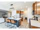Open-concept kitchen with a large island, seating, and views into the adjacent living area at 1381 Delacorte Cir, Shelbyville, IN 46176