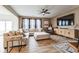 Spacious living room with neutral tones, modern decor, and lots of natural light from large windows at 1381 Delacorte Cir, Shelbyville, IN 46176