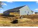 Backyard of home features a new deck and grading in preparation for landscaping at 140 Mission Terrace Dr, Whiteland, IN 46184